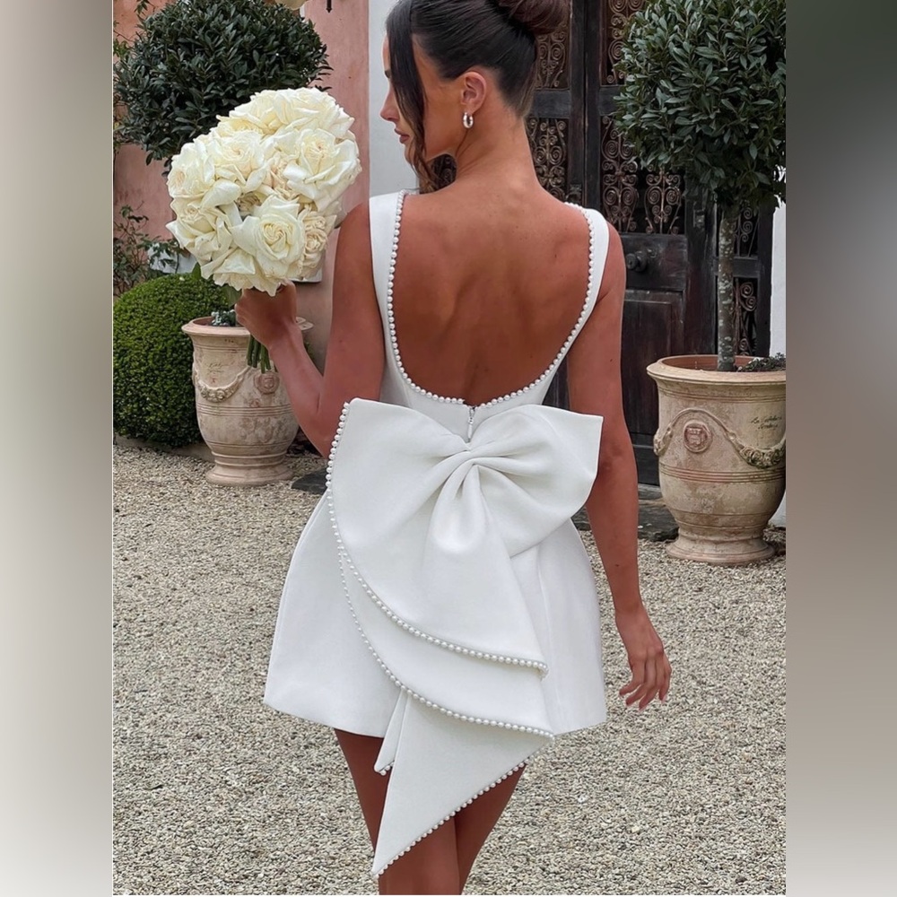 Pearl-Trim White Backless Mini Dress with Statement Bow